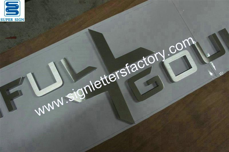 Fabricated brushed stainless steel letter signs