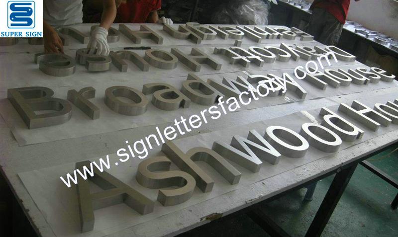Fabricated brushed stainless steel letter sign