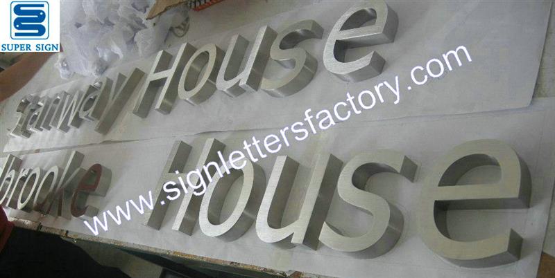 Fabricated brushed stainless steel letter sign