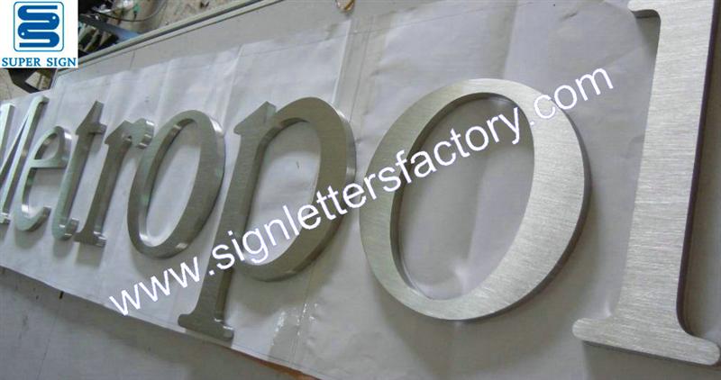 Fabricated brushed stainless steel letter