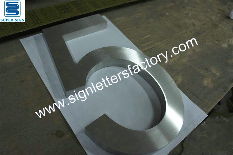 Fabricated brushed stainless steel numbers