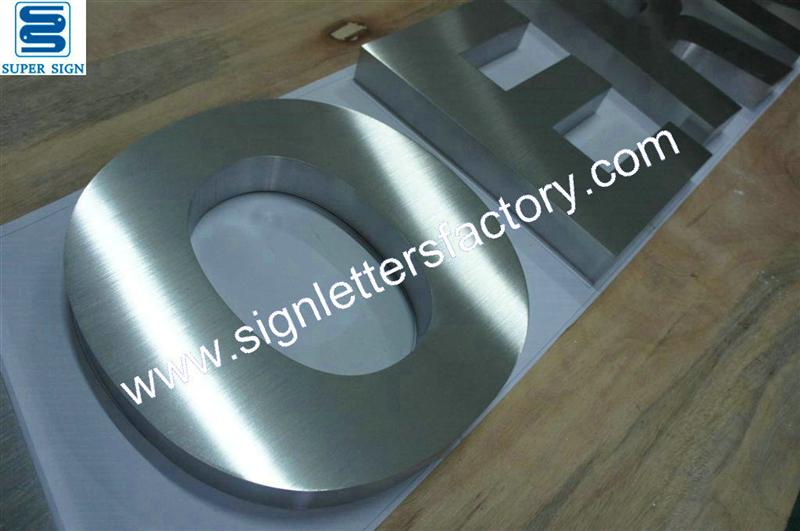 fabricated brushed stainless steel shop signage