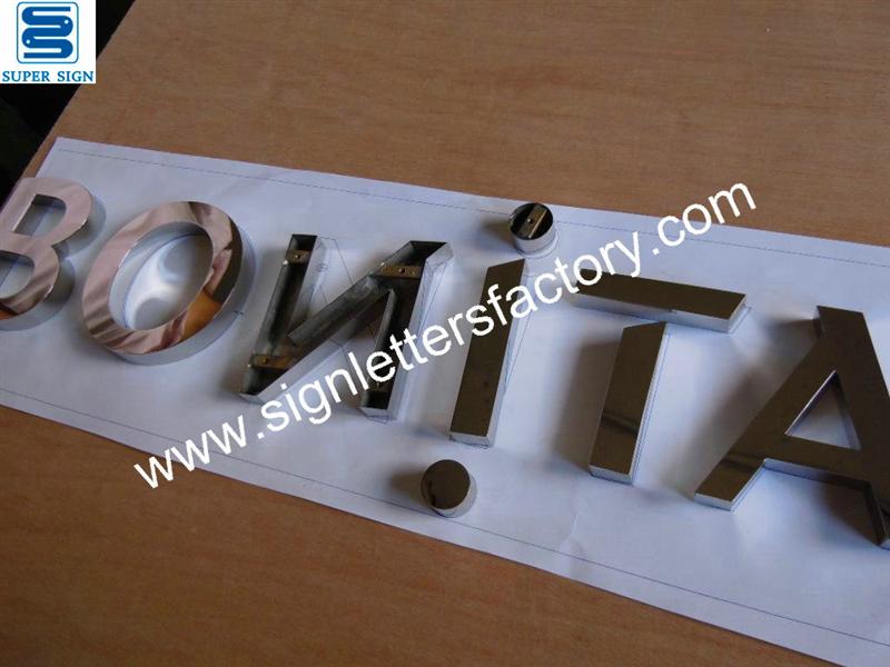 polished stainless steel company sign