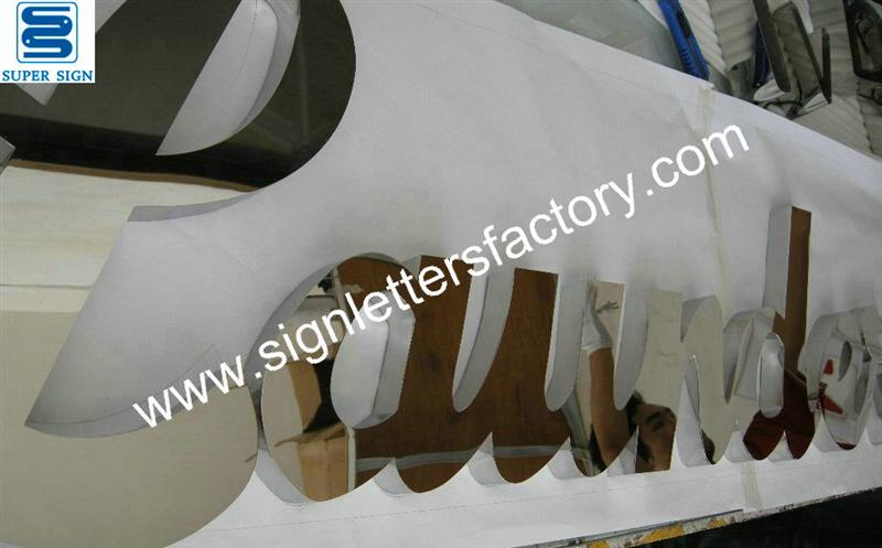 fabricated polished stainless steel text sign